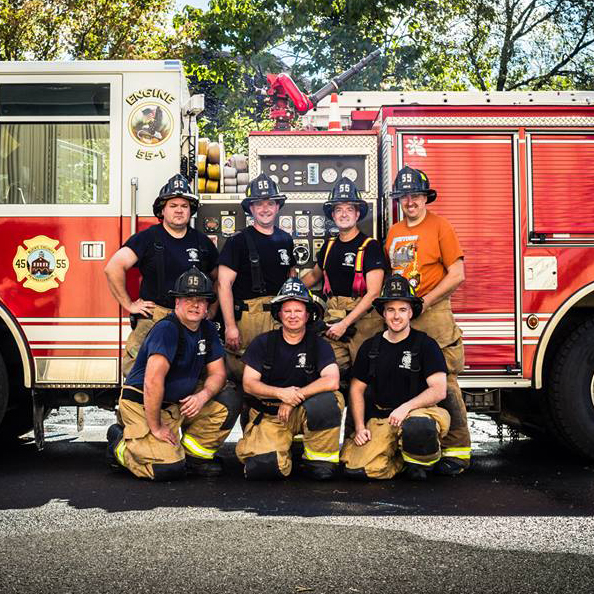 Newtown Emergency Services Department Group Shot in front of engine